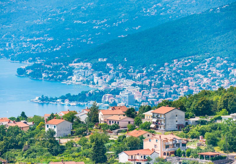 Opatija city in Croatia view from above with blue water of Kvarner bay on a sunny day stock photos Opatija city in Croatia view from above with blue water of Kvarner bay on a sunny day stock photos