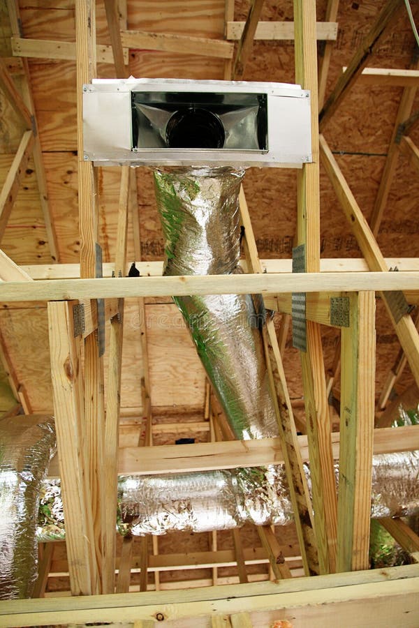 Open AC Heating Vent and Tubing in Ceiling of New Home Stock Photo
