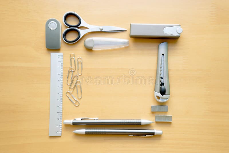 Open album with school supplies on the table