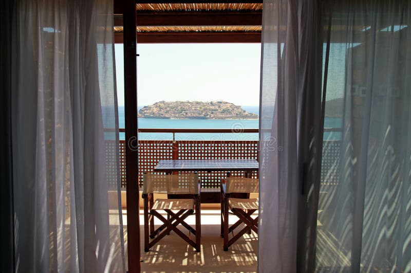 Open balcony with furniture and sea view(Greece)
