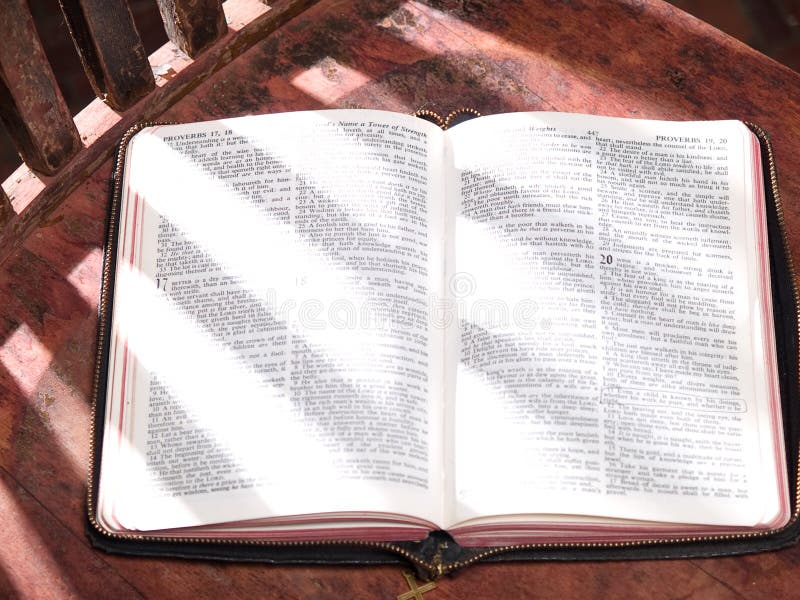 Open Bible Sitting on Old Wooden Sunlit Chair Stock Photo Image of streaming, sunlight 8529990