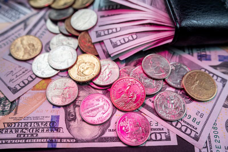 Open black wallet with coins and US dollar bills. Economic crisis. world economy. preservation of household finances. Selective focus. Up close