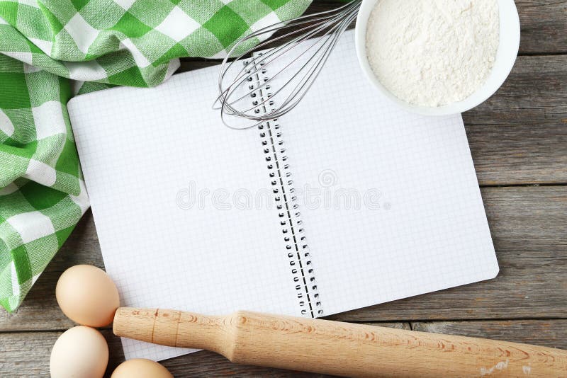 Open blank recipe book on grey wooden background