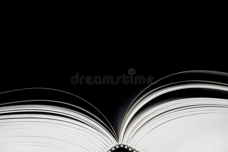 Open book on black background. Copy space royalty free stock image