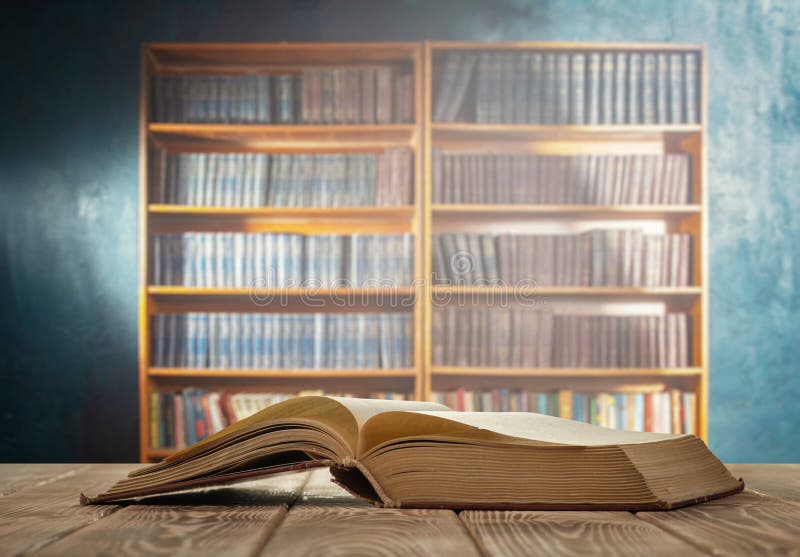 Open book and bookcase stock photos