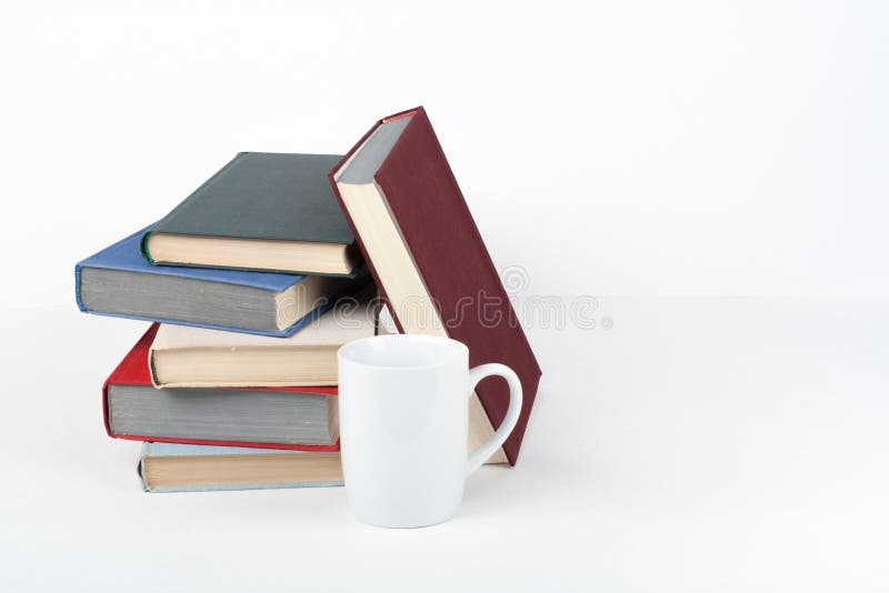 https://thumbs.dreamstime.com/b/open-book-hardback-colorful-books-wooden-table-white-background-back-to-school-cup-copy-space-text-education-business-212488383.jpg