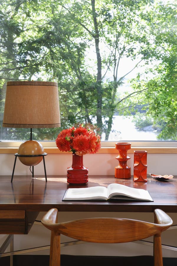 Open Book, Lamp And Retro Ornaments On Desk