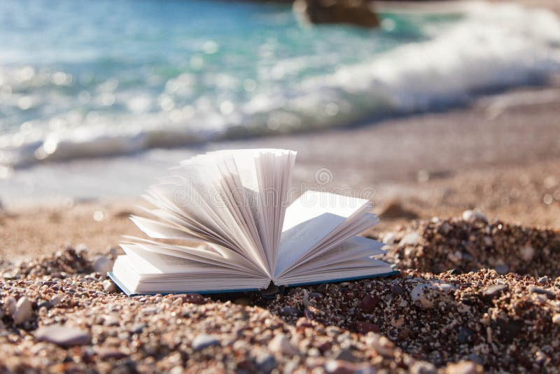 Open Book On Sea Beach Concept Of Reading Relaxation On Coast