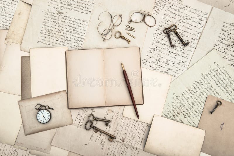 Open book, vintage accessories, old letters