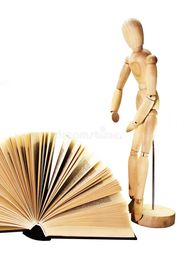 Open book and wooden dummy