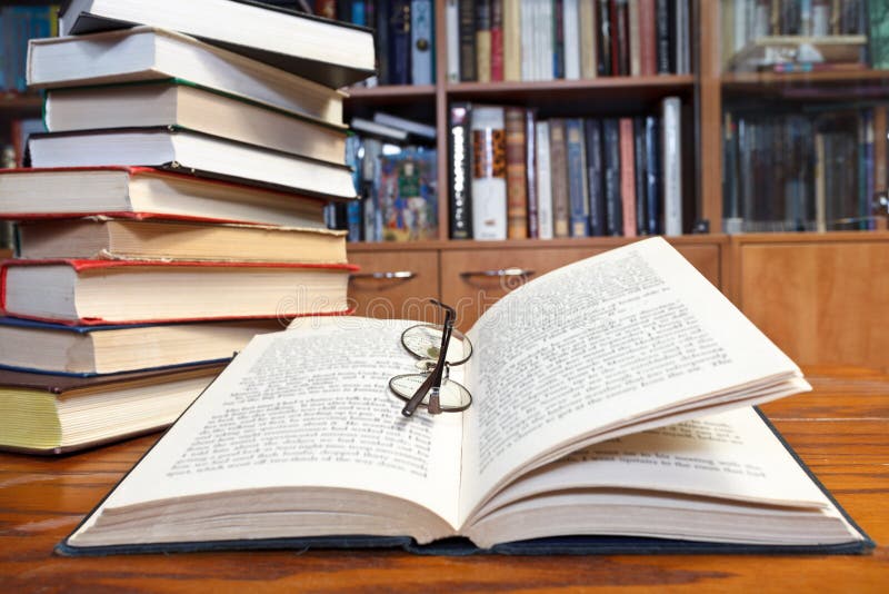 Open books on wooden table