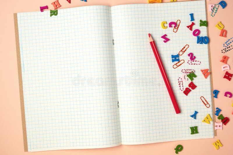 open checked notebook and red wooden pencil stock photos open checked notebook and red wooden pencil stock photos