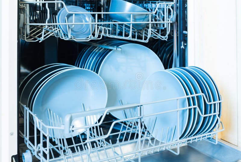 Open Dishwasher with Clean Dishes. Clean Glasses after Washing in the
