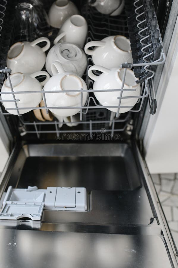 Open Dishwasher with Clean Glass and Dishes, Selective Focus Stock