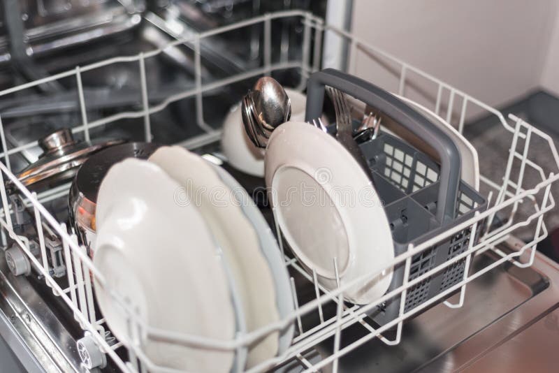 Open Dishwasher with Clean Glass and Dishes, Selective Focus Stock