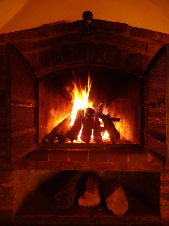 Open doors Fireplace stock image. Image of fireplace 103510179