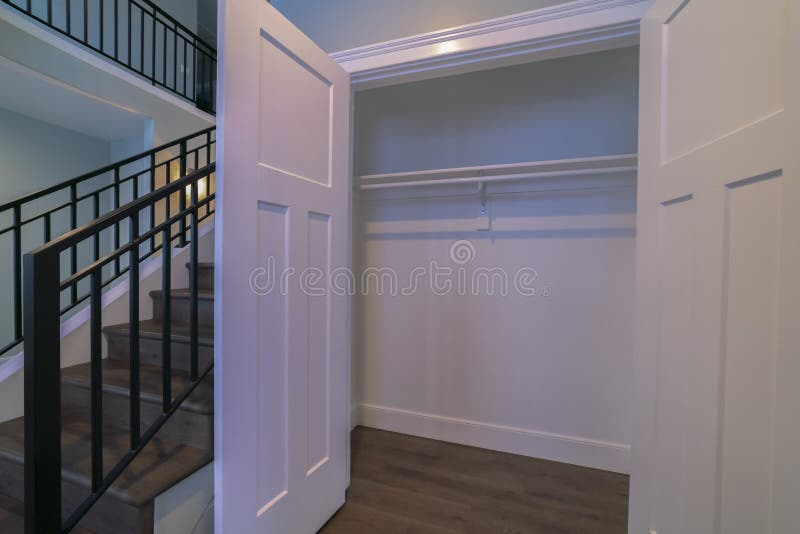 Open Empty Cupboard Door With Rails Bright Interior Stock Photo
