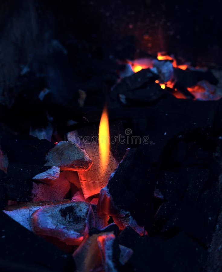 Open fire barbecue background: Burning charcoal with hot flame close up. Blue and orange. Camp fire, grill, traditional stove royalty free stock photos Open fire barbecue background: Burning charcoal with hot flame close up. Blue and orange. Camp fire, grill, traditional stove royalty free stock photos