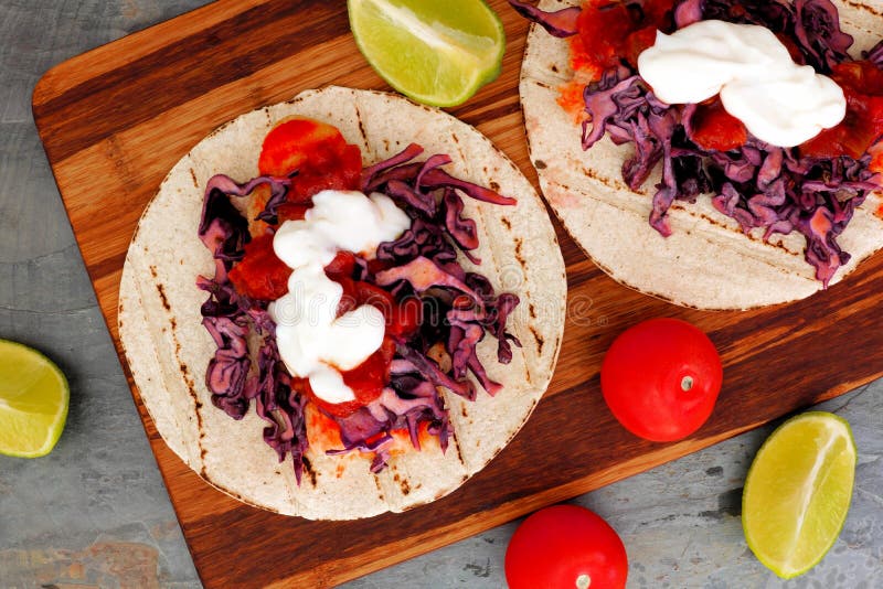 Open fish tacos with red cabbage lime slaw and salsa royalty free stock image