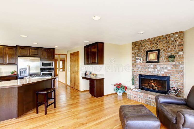 Open Floor Plan Kitchen And Living Room With Brick 