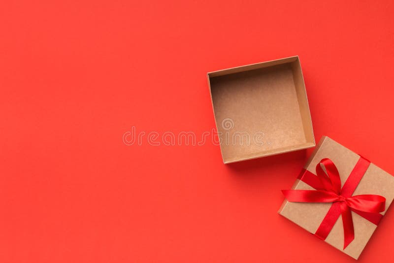 Open gift box with ribbon bow top view