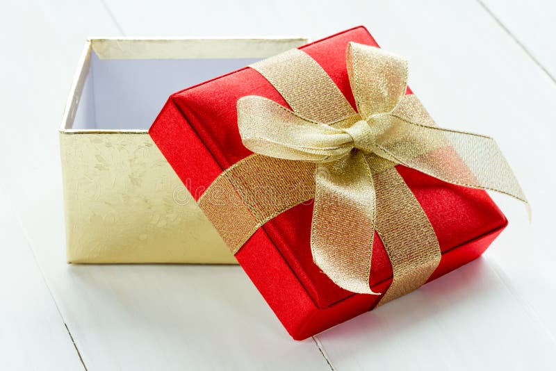 Open Gift Box On The Wooden Background Stock Photo Image