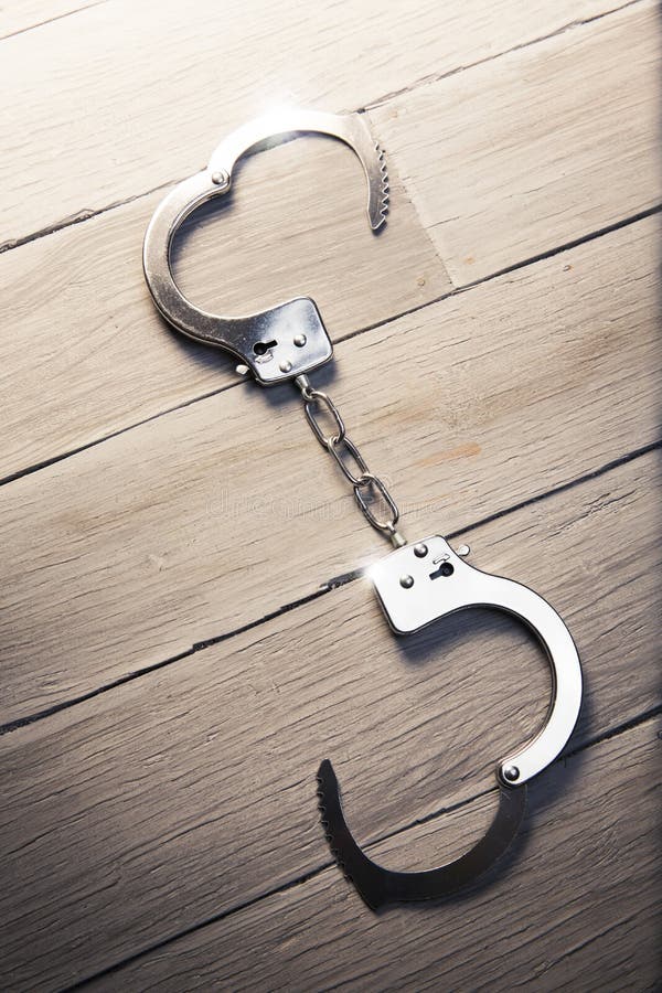 Open Handcuffs On A Wooden Background Stock Image Image of arrest