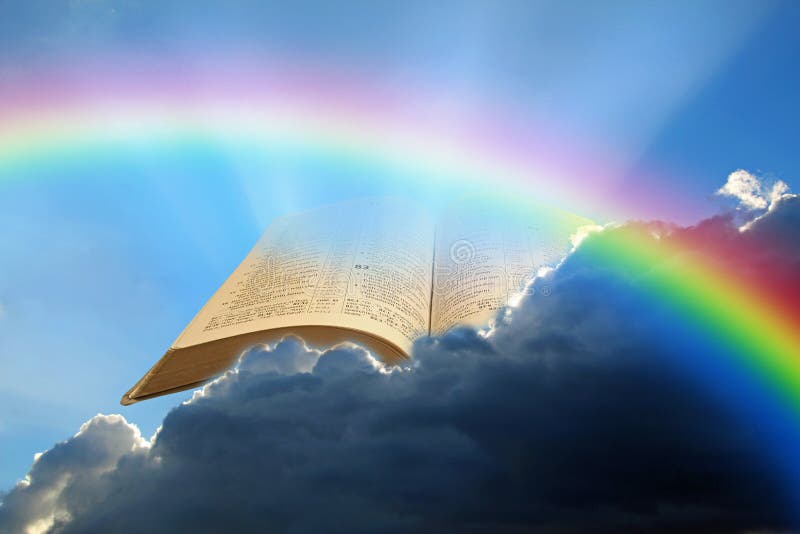 Concept of open holy bible in clouds with sun rays and rainbow penetrating the darkness. Concept of open holy bible in clouds with sun rays and rainbow penetrating the darkness.
