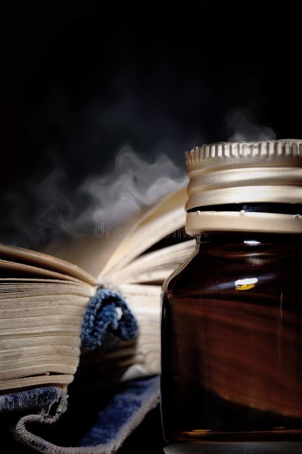 Open magic book and vial royalty free stock photos Open magic book and vial royalty free stock photos