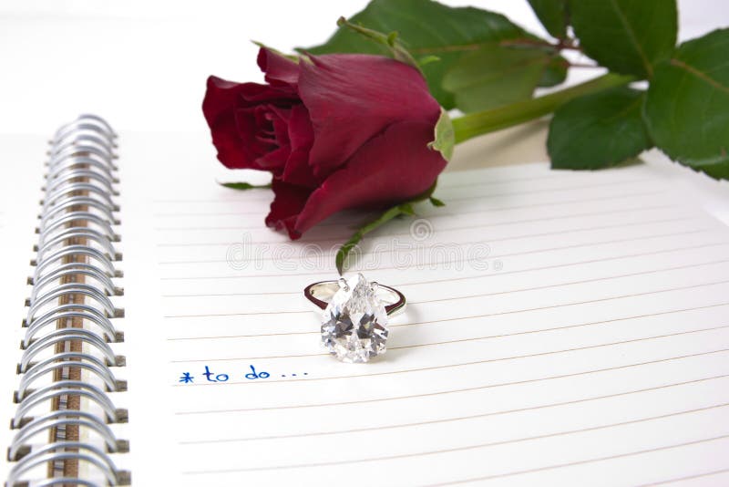 Open notebook and diamond ring...valentin concept