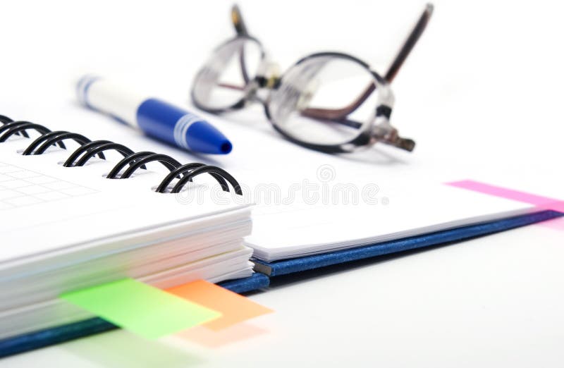 Open notebook with glasses