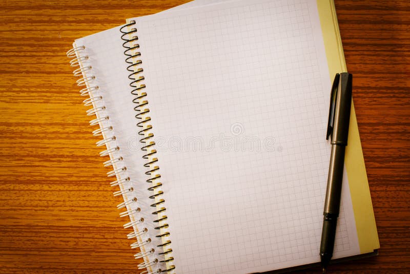 Open Notebook On The Table And Ballpoint Pen