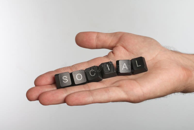 Open palm with six computer buttons with word SOCIAL royalty free stock image Open palm with six computer buttons with word SOCIAL royalty free stock image