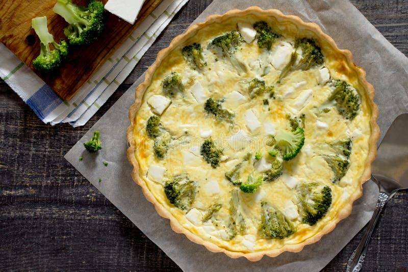 Open Pie Quiche Lauren with Broccoli and Cheese on a Dark Wooden Table ...