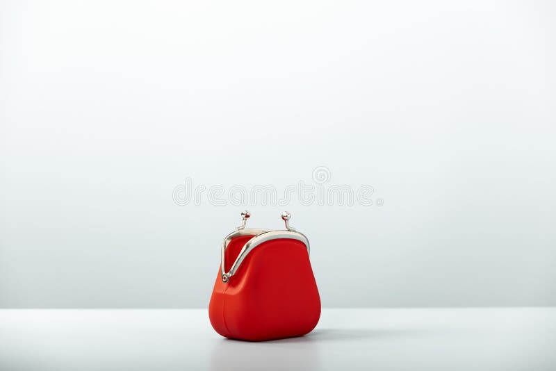 Open Red Coin Purse on blue background with copy space stock photography