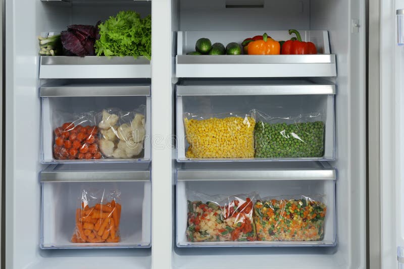 Frozen Food In The Refrigerator. Vegetables On The Freezer Shelves. Stock Image Image of