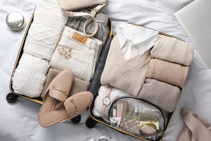 Open Suitcase with Folded Clothes, Shoes and Accessories on Bed, Top ...