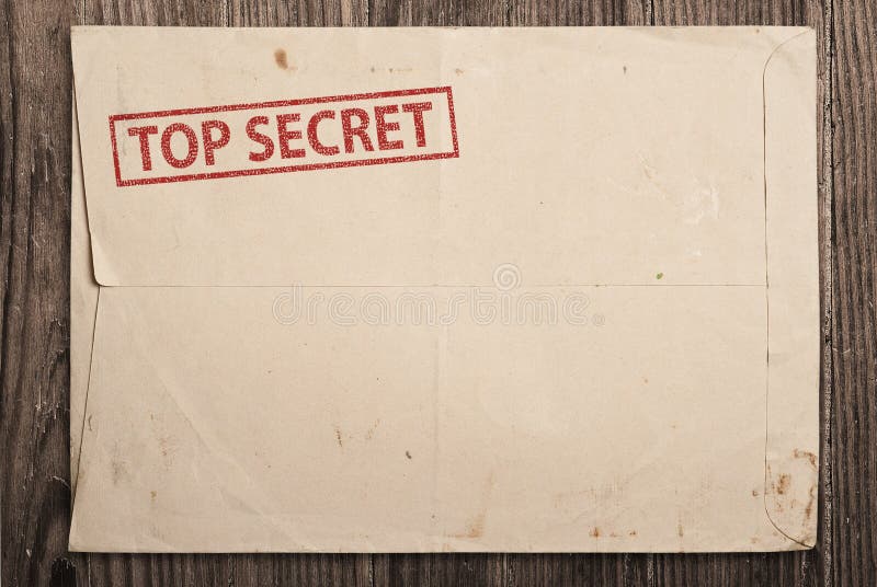 Open yellow envelope with top secret stamp and papers, on wooden table, clipping path. Open yellow envelope with top secret stamp and papers, on wooden table, clipping path.