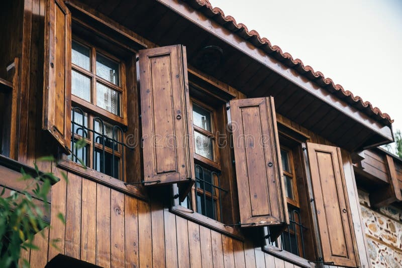 Open Wooden Shutters on Wooden Windows in a Turkish House. Stock Image