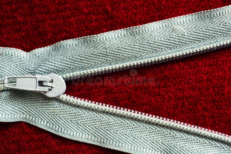 Open Zipper with a Runner on a Red Cloth Stock Photo Image of macro