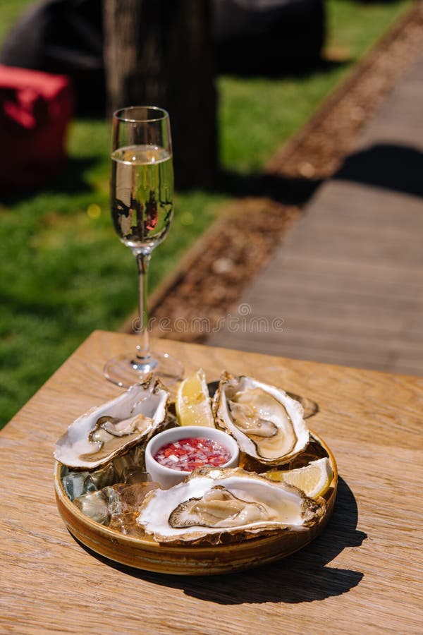 Opened Oysters and Lemon with White Wine Stock Image Image of luxury