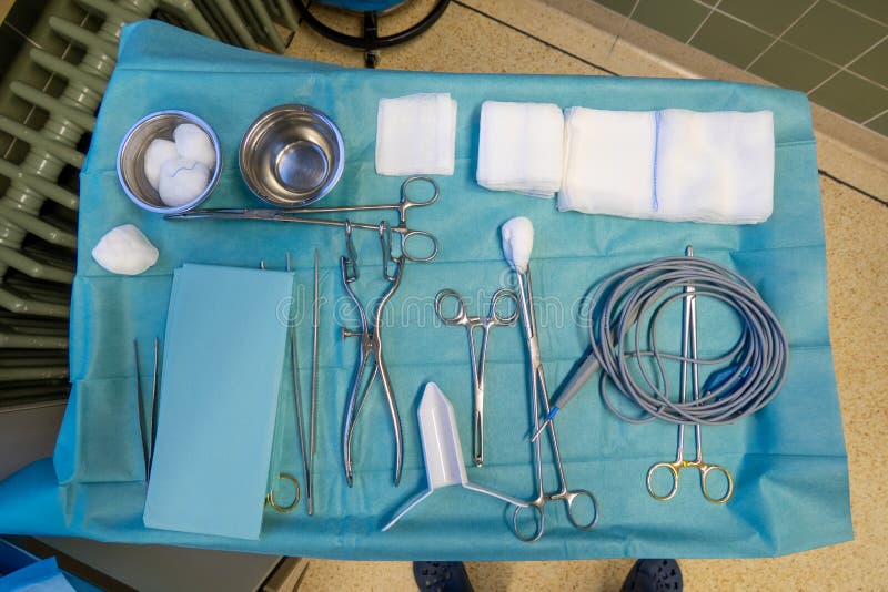 On operating table lie the instruments for a proctoscopic procedure. On an operating table are the instruments for a proctoscopic operation
