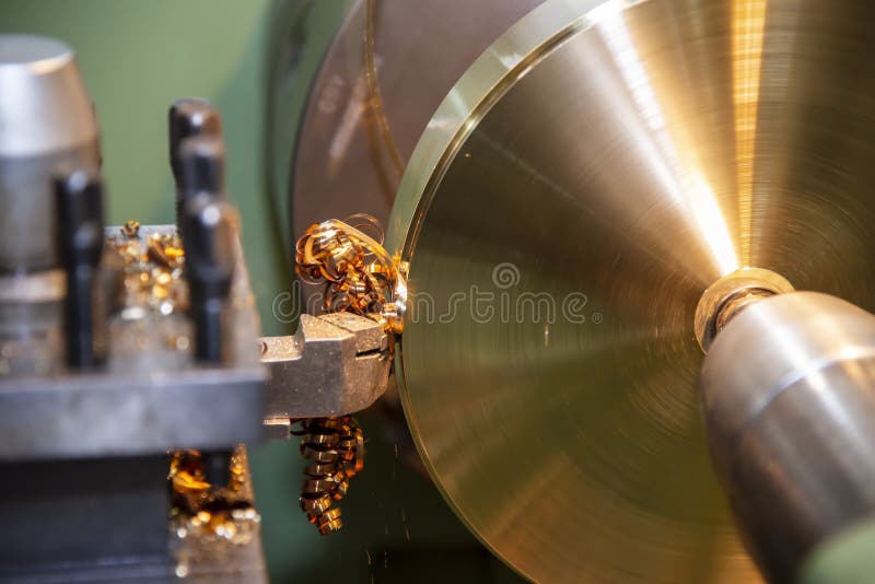 The Operation of Lathe Machine Cutting the Brass Plate Parts with the