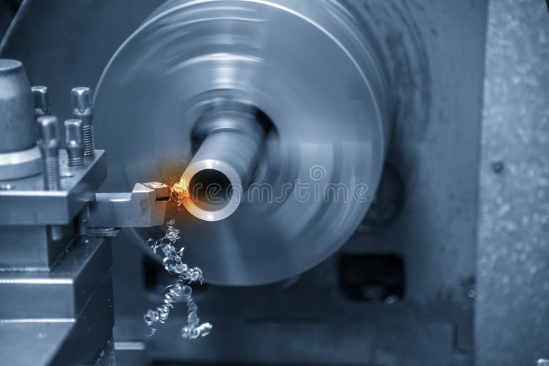 The Operation of Lathe Machine Cutting the Steel Shaft. Stock Image