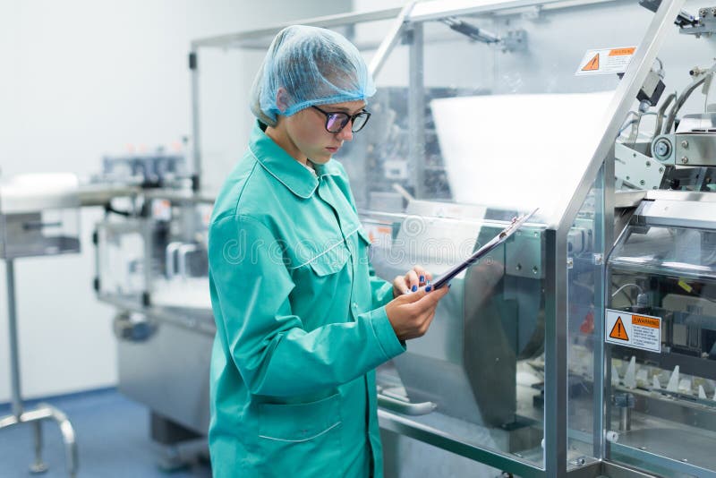 The operator controls the machine in the factory work royalty free stock photo The operator controls the machine in the factory work royalty free stock photo