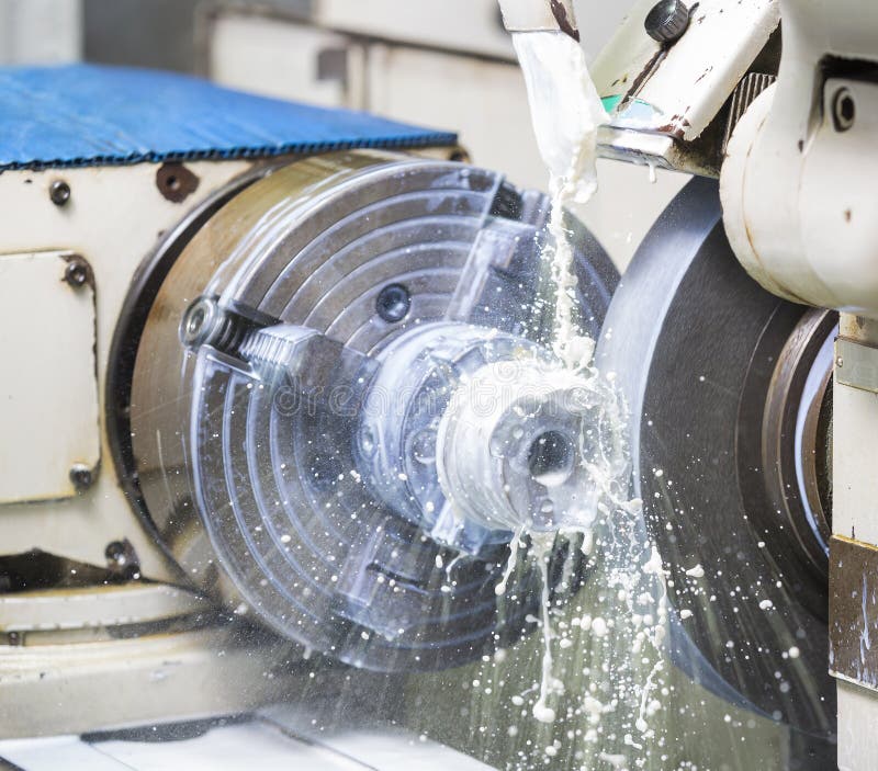 Operator grinding forging die parts stock photography