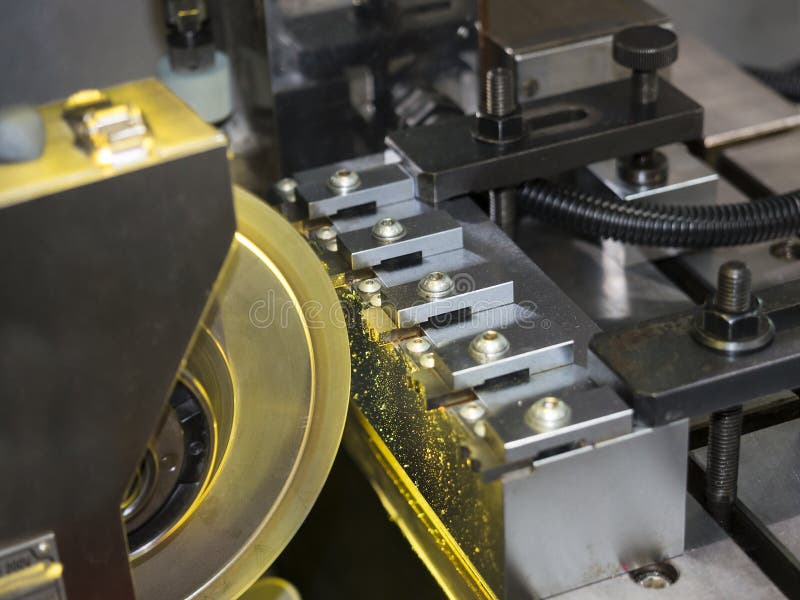 Operator grinding and inspection high precision automotive part royalty free stock photo