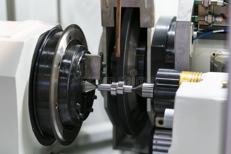Operator grinding mold and die part stock photos