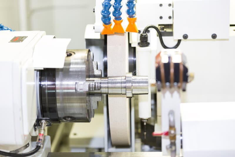 Operator grinding mold and die part stock photo
