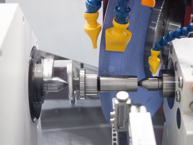 Operator grinding mold and die part stock images